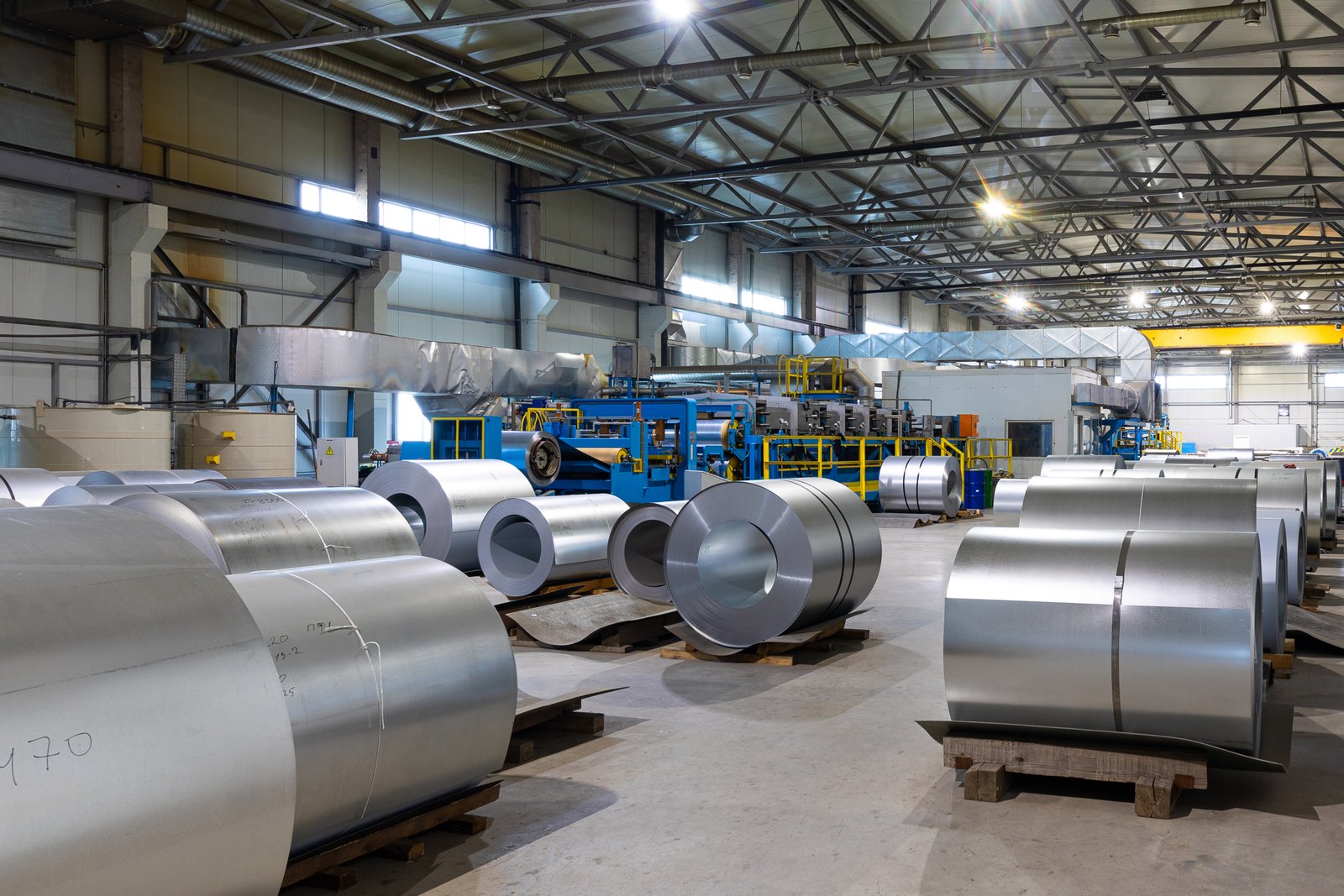 AKS workshop storing multiple stainless steel coils ready for annealing process, indicating strong supply chain and stock capabilities.