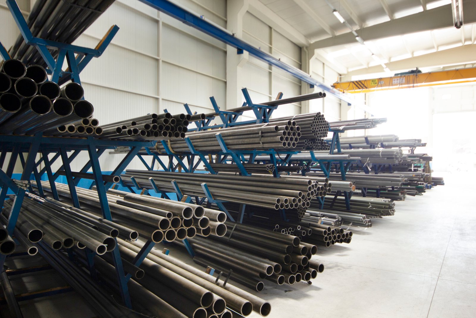 Heavy-duty hot rolled stainless steel coils organized in warehouse, ready for annealing and industrial processing