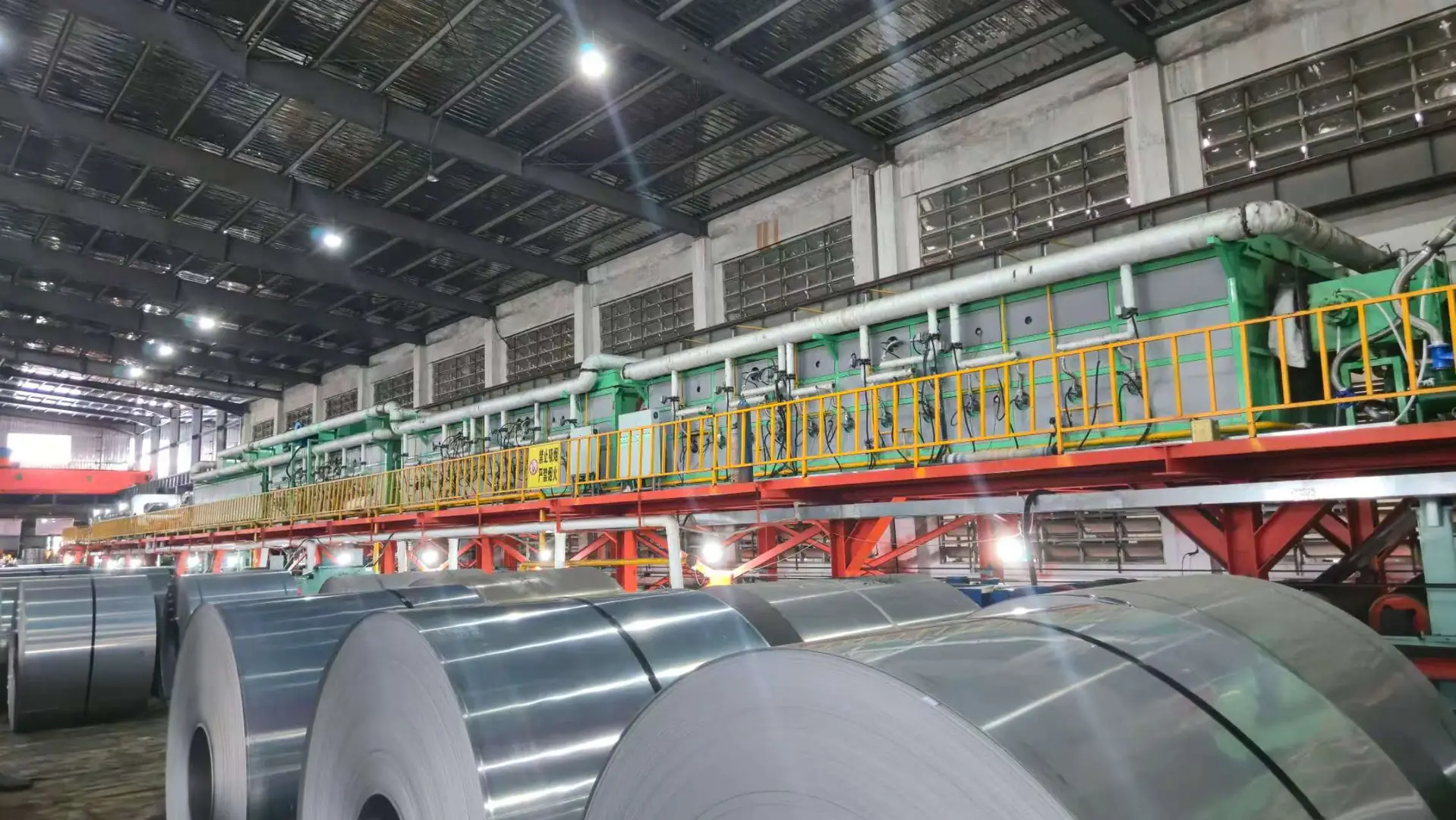 AKS bright annealing furnace processing metal coils in industrial facility