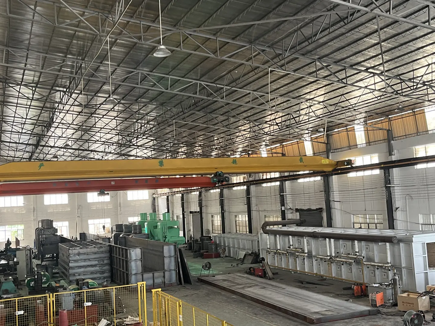 Large industrial heat treatment equipment and machinery in spacious factory setting